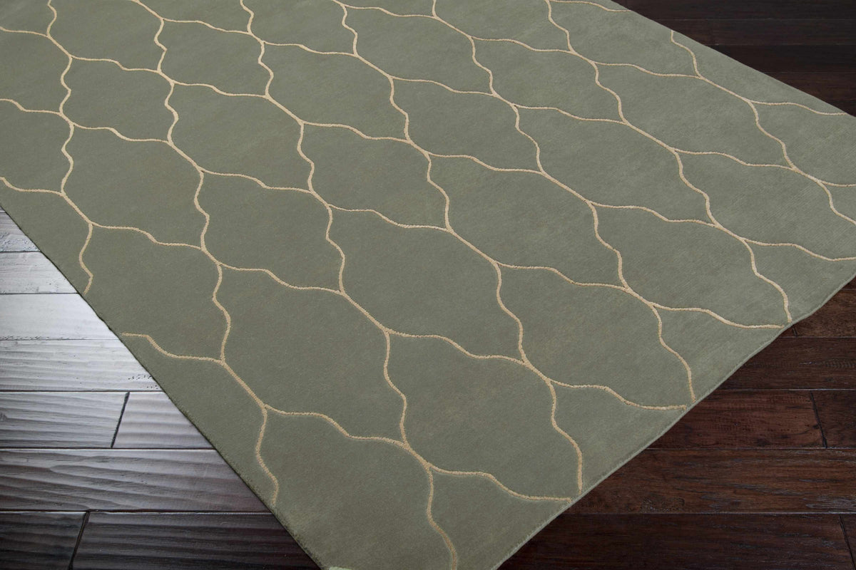 Woodland Area Carpet Rug olive green with beige wavy lines on dark wood floor on Tampa Home & Garden Store