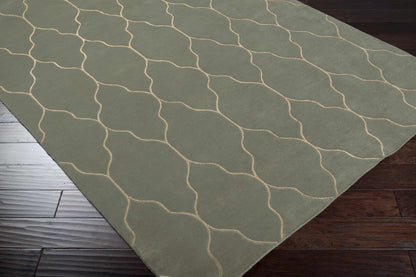 Woodland Area Carpet Rug olive green with beige wavy lines on dark wood floor on Tampa Home & Garden Store