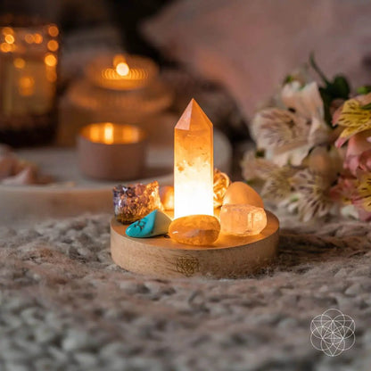 Wealth Goddess Night Light by Conscious Items with a crystal quartz obelisk and stones on base on Tampa Home & Garden Store