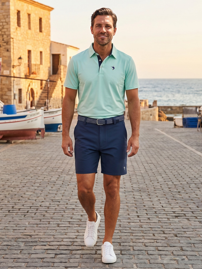 Coastal Performacne Polo White Water Life mint green polo with navy placket at seaside harbor on Tampa Home & Garden Store