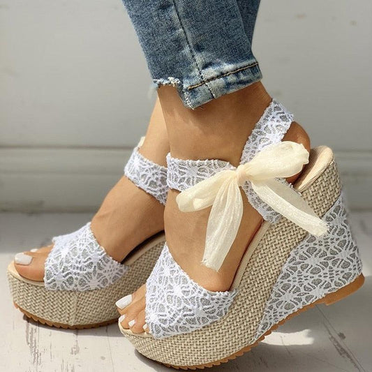 Wedding lace wedge sandals by Stevvex with white lace straps and bow on jute platform espadrille on Tampa Home & Garden Store