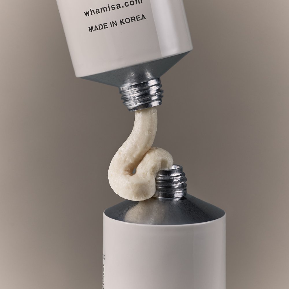Whamisa Organic Seeds Hand Cream 60ml dispensed as a creamy swirl between white tubes on Tampa Home & Garden Store