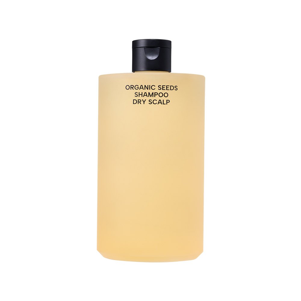 Shampoo Organic Seeds Dry Scalp bottle in pale yellow with black cap on Tampa Home & Garden Store