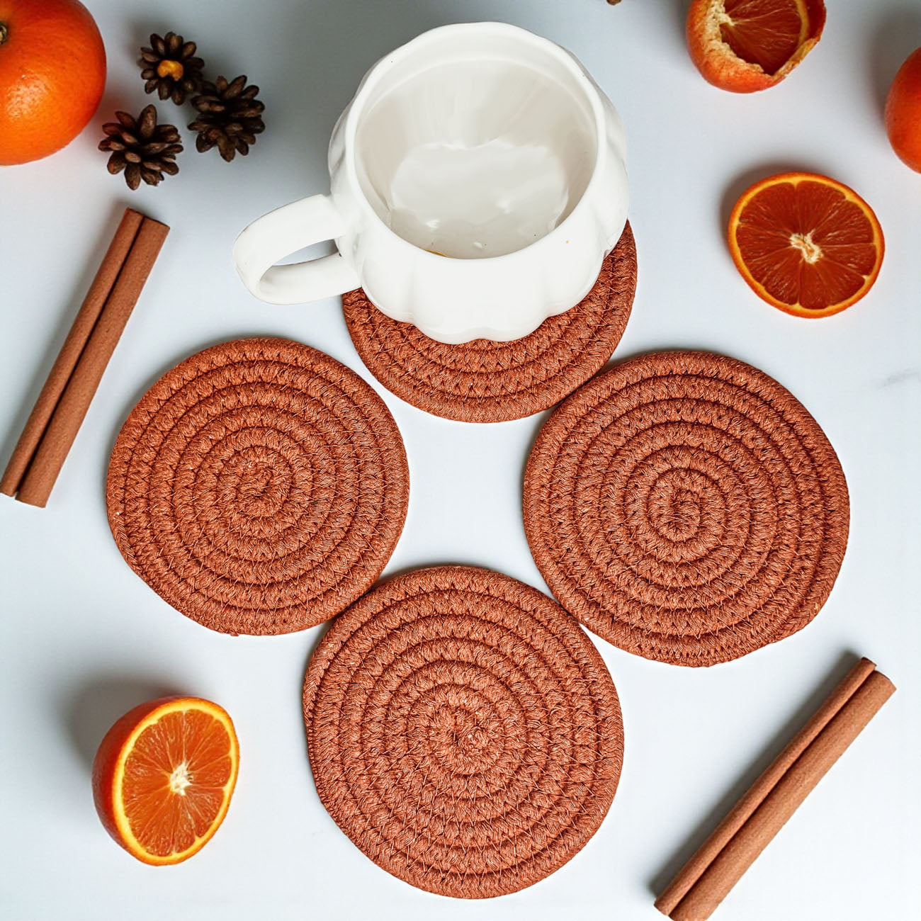 Fall Fabric Coasters set of four round braided terra cotta coasters with a white mug on Tampa Home & Garden Store