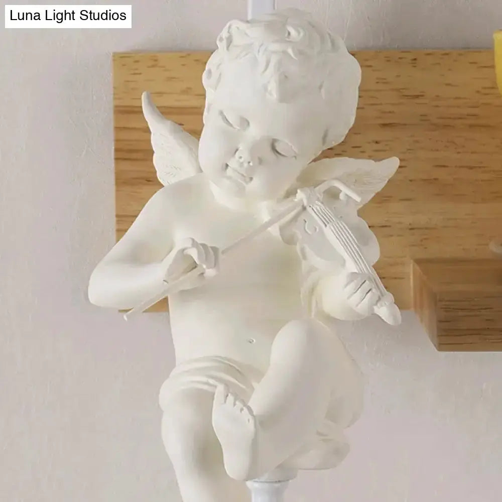 White angel cherub ceramic wall sconce statue playing a violin with wings on Tampa Home & Garden Store