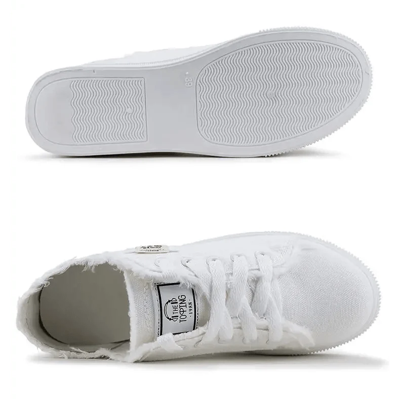 White canvas womens sneakers by Stevvex, lace-up low-top with frayed edges and clean white sole on Tampa Home & Garden Store