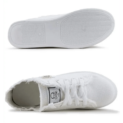 White canvas womens sneakers by Stevvex, lace-up low-top with frayed edges and clean white sole on Tampa Home & Garden Store