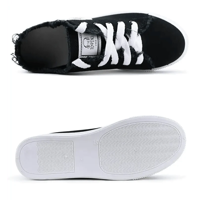 Womens sneakers with black distressed denim upper, white laces and white sole on Tampa Home & Garden Store