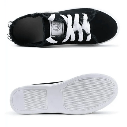 Womens sneakers with black distressed denim upper, white laces and white sole on Tampa Home & Garden Store