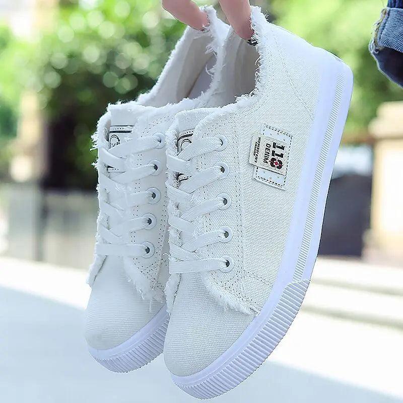 White canvas women's sneakers by Stevvex with frayed edges and lace-up design on Tampa Home & Garden Store
