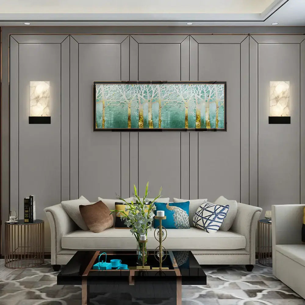 White marbled glass and gold wall sconces pair in a modern living room by Decorbites on Tampa Home & Garden Store
