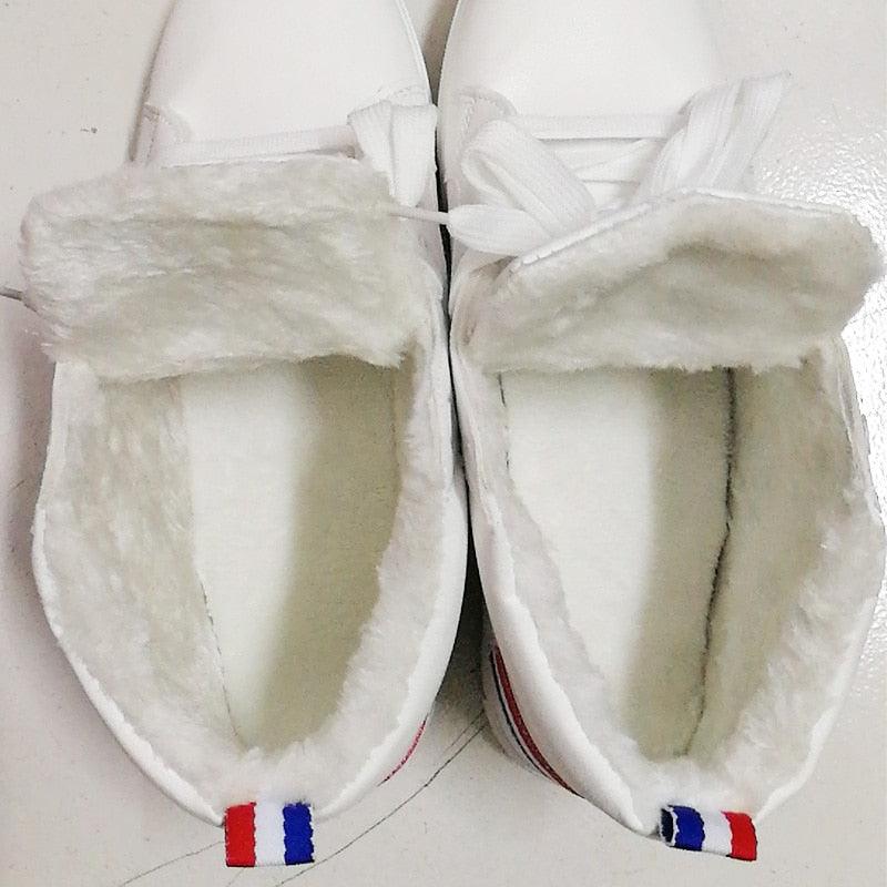 Pair of Stevvex white leather winter plush sneakers with faux fur lining and lace-up high-top design on Tampa Home & Garden Store