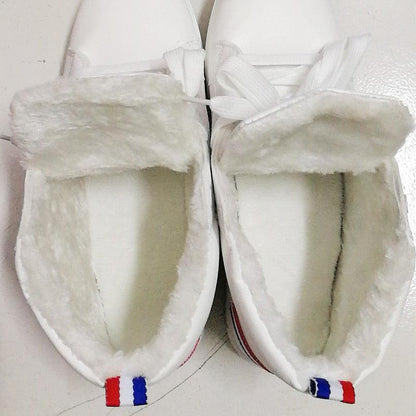 Pair of Stevvex white leather winter plush sneakers with faux fur lining and lace-up high-top design on Tampa Home & Garden Store