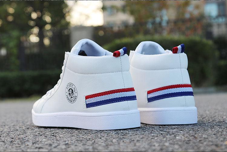White Stevvex leather high-top sneakers with red and blue striped heel and side logo patch on Tampa Home & Garden Store