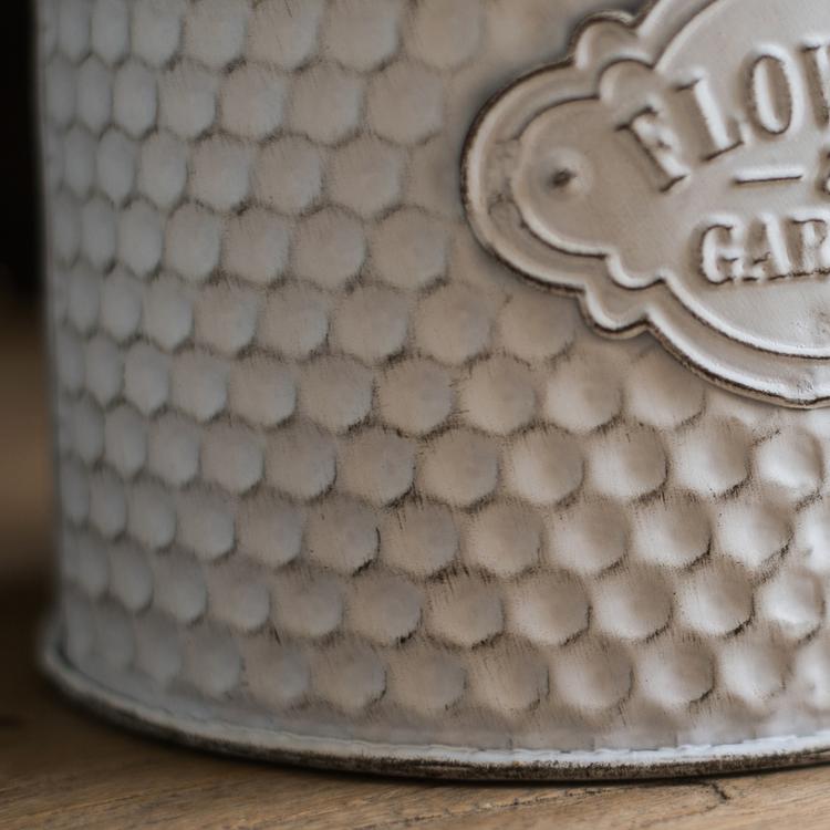 White iron flower garden barrel with fish-scale texture and badge RusticReach planter on Tampa Home & Garden Store