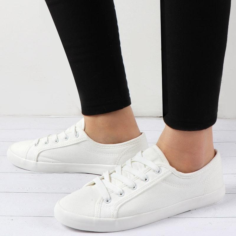 Stevvex white sneakers, low-top canvas casual walking shoes with lace-up design on Tampa Home & Garden Store