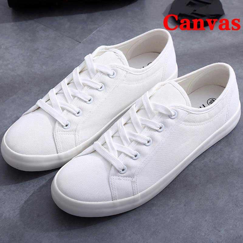 White canvas low-top sneakers with laces and rubber sole, casual walking shoes on Tampa Home & Garden Store