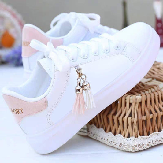 Stevvex white low-top sneakers for women with lace-up design, pink heel patch, and tassel charm on Tampa Home & Garden Store