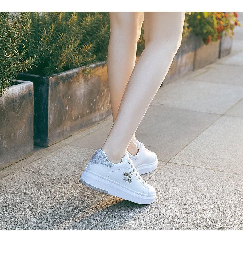 White Stevvex women's platform sneakers with rhinestone bee detail, lace-up, pair on Tampa Home & Garden Store