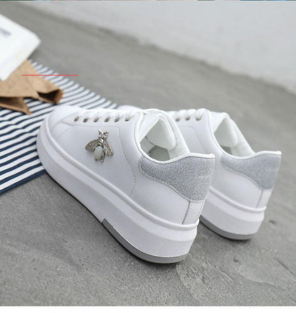 White platform sneakers with lace-up front, silver glitter heel, rhinestone bee charm on Tampa Home & Garden Store