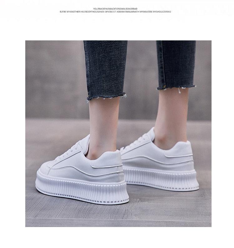 Stevvex white platform sneakers with leather upper and chunky sole, model in cropped jeans on Tampa Home & Garden Store