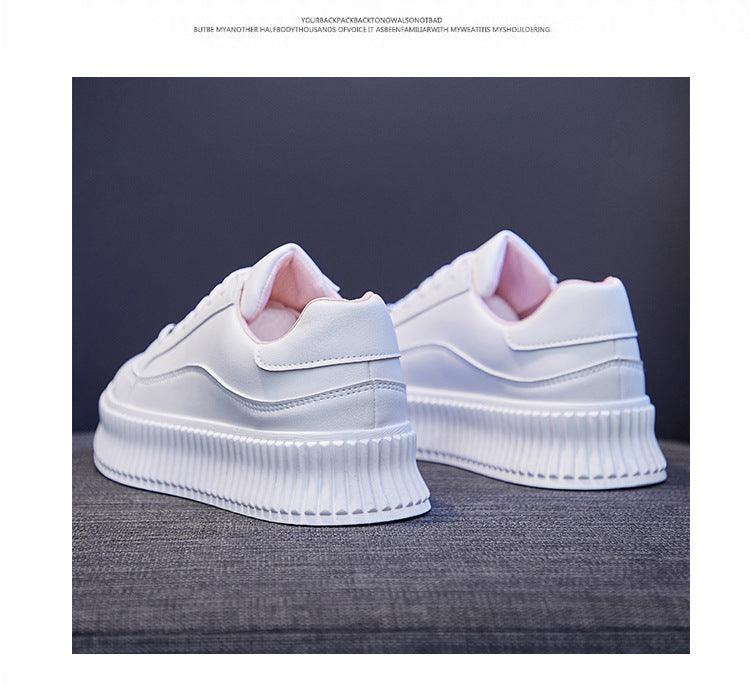 White leather platform sneakers pair featuring pink lining on Tampa Home & Garden Store