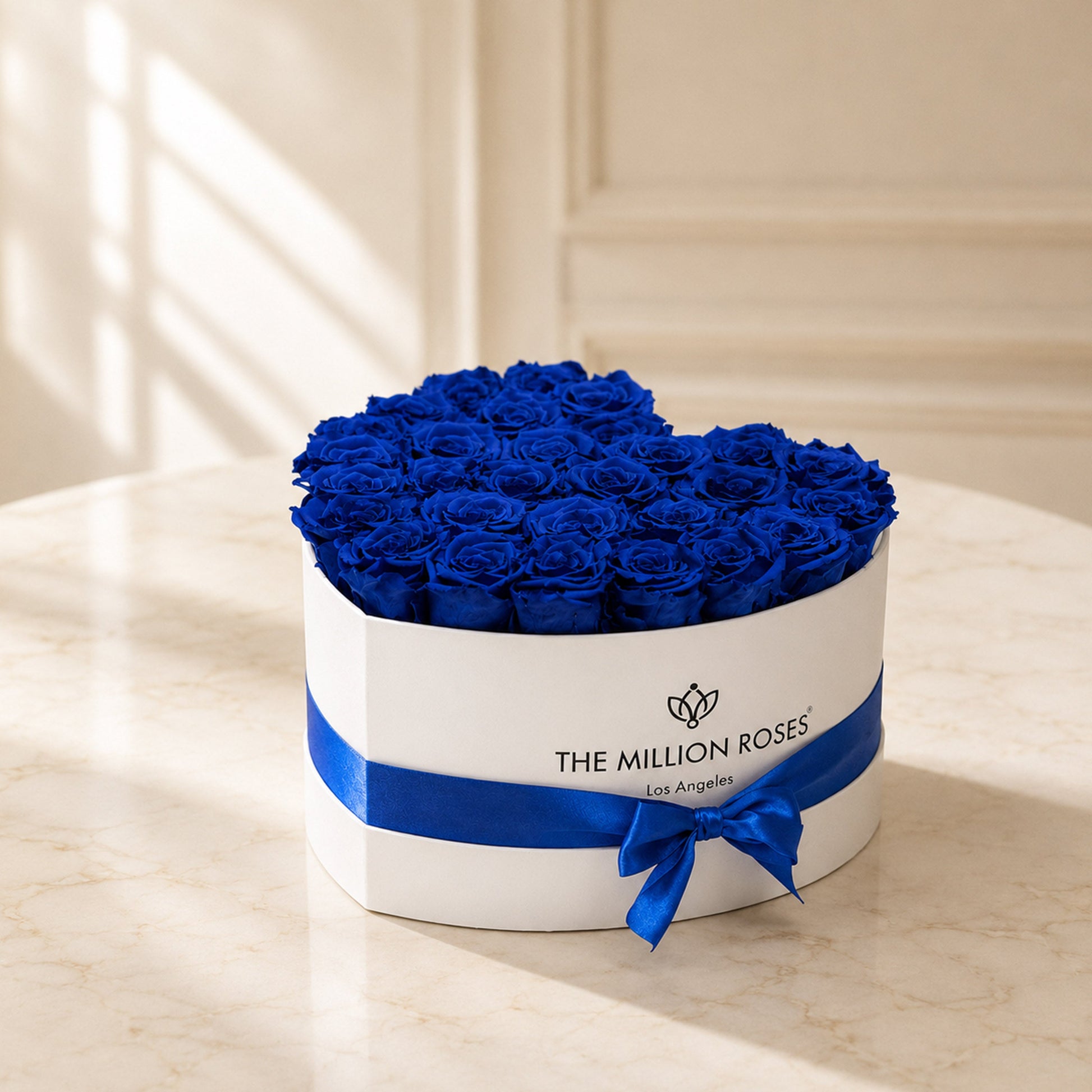 Royal blue eternity roses in a white round box by The Million Roses on Tampa Home & Garden Store