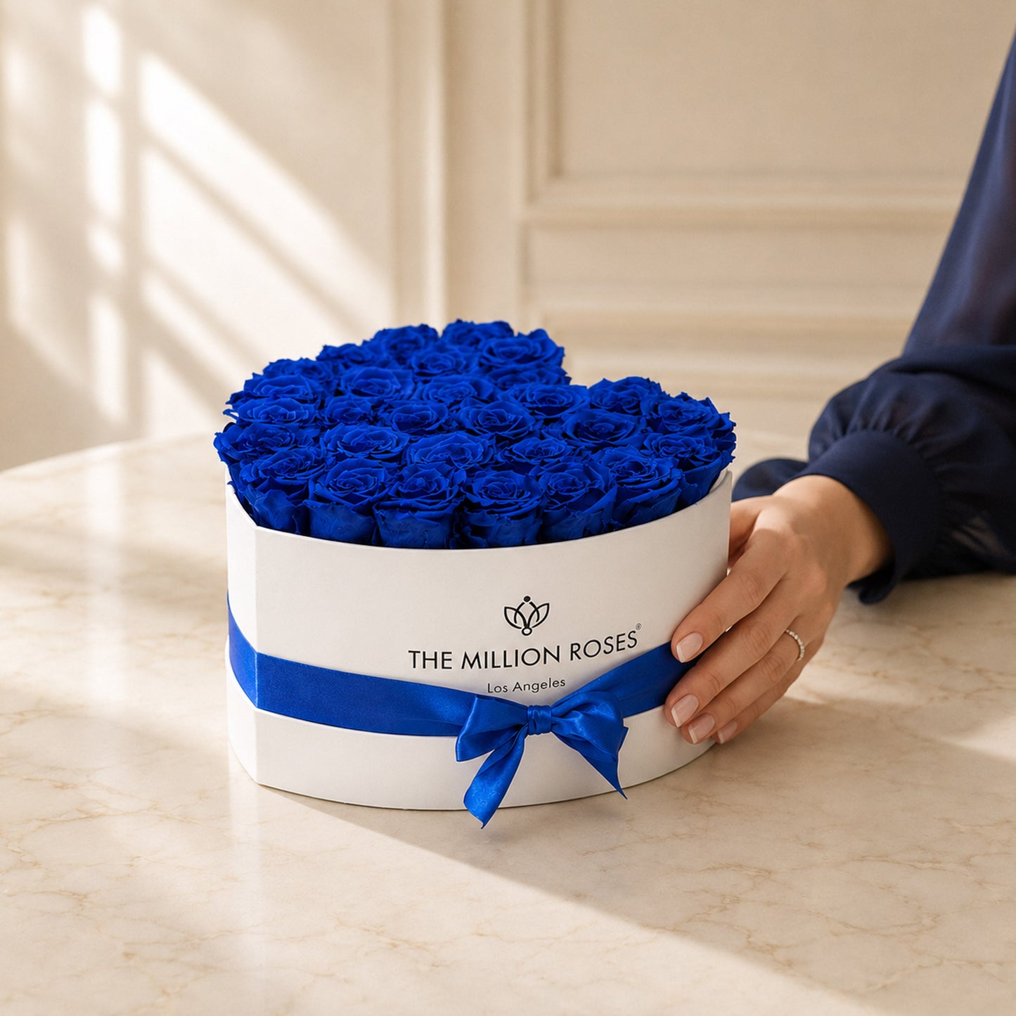 Royal blue eternity roses bouquet in a white heart box with blue ribbon The Million Roses on Tampa Home & Garden Store