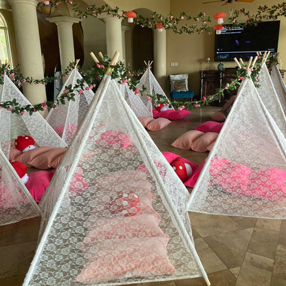 Dainty Lace Kids Teepee Tent in white ivory lace with wooden poles; several play tents indoors with pink cushions on Tampa Home & Garden Store