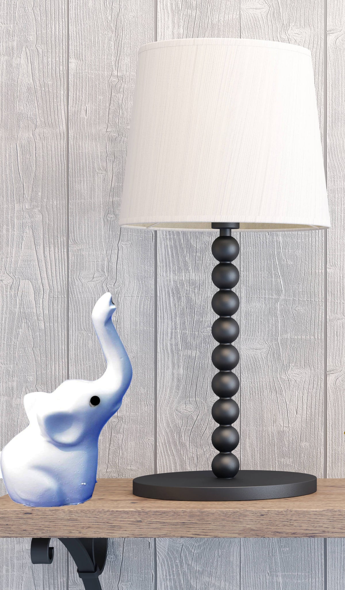 Vibhsa Baby Elephant Ring Holder white ceramic elephant jewelry organizer beside a beaded lamp on Tampa Home & Garden Store