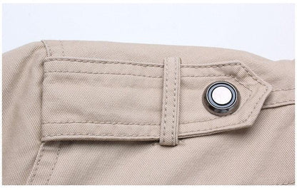 Beige windproof bomber jacket closeup with a strap tab and metal snap button on Tampa Home & Garden Store