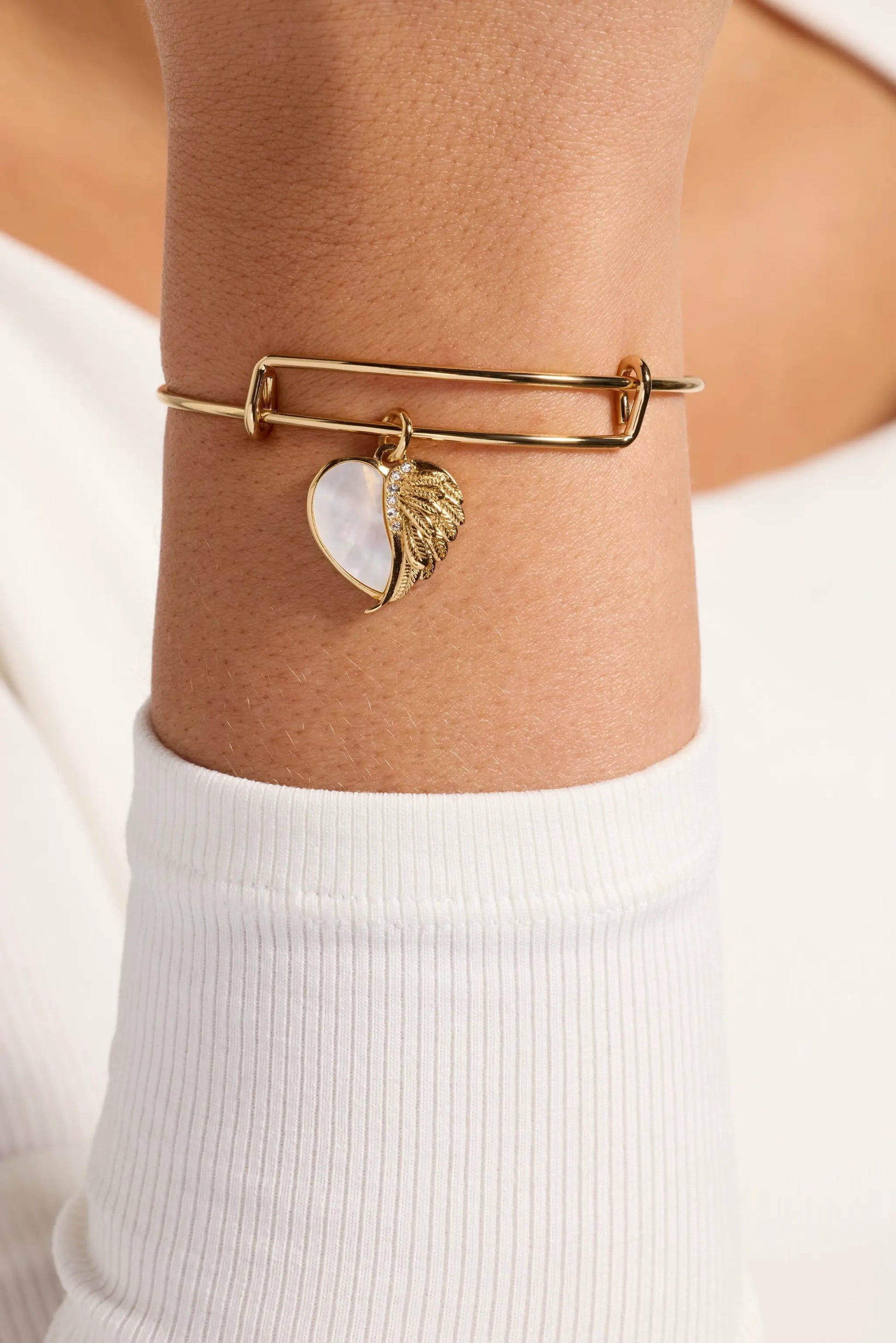 Alex and Ani Wings of Protection goldtone bangle with mother of pearl heart charm on Tampa Home & Garden Store