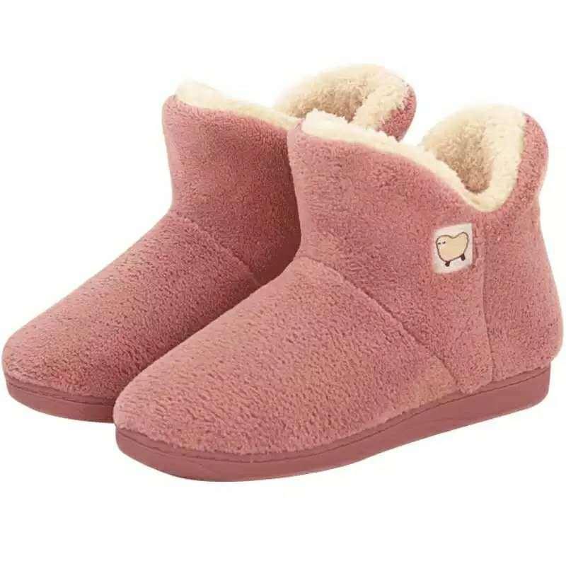Pink plush women's slippers with cream faux fur lining, closed-back indoor shoes on Tampa Home & Garden Store