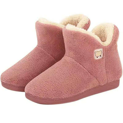Pink plush women's slippers with cream faux fur lining, closed-back indoor shoes on Tampa Home & Garden Store