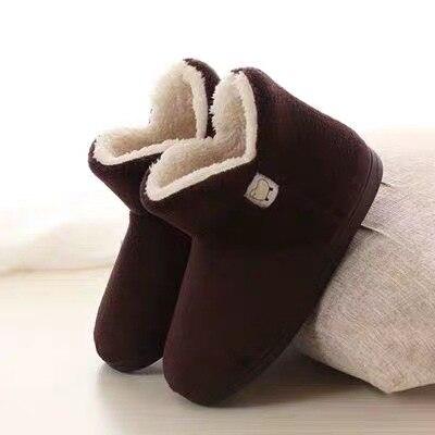 Stevvex women's dark brown slippers pair with cream shearling lining and closed back on Tampa Home & Garden Store