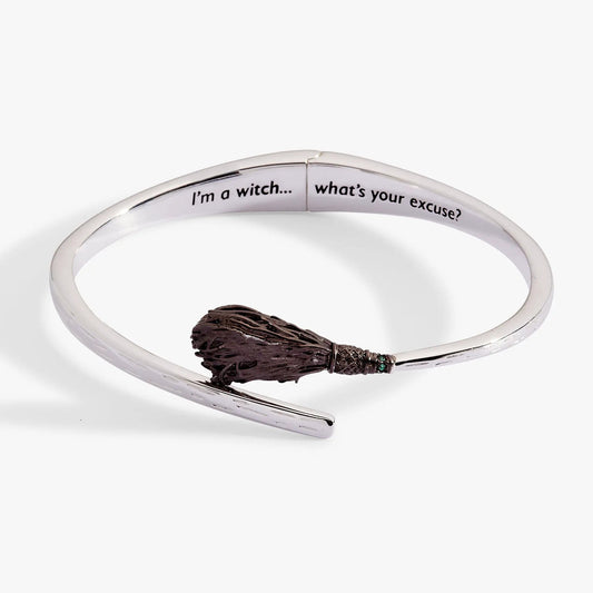 Wizard of Oz Wicked Witch bypass cuff bracelet with white enamel text and brown wand charm on Tampa Home & Garden Store