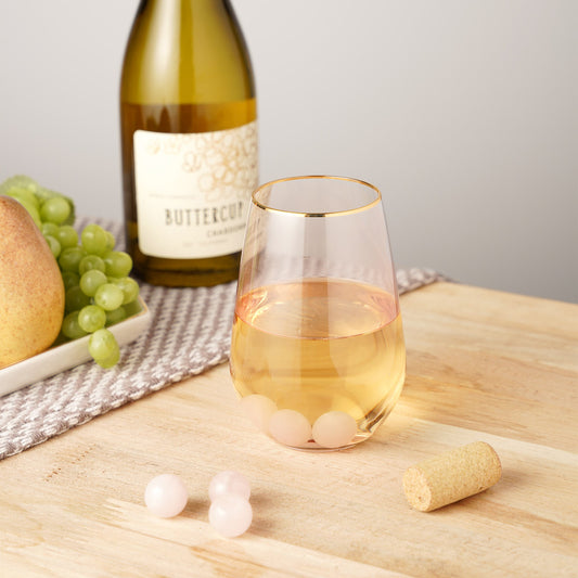 Rose Quartz Wine Gems set of 6 chilling cubes in pale pink beside wine bottle on Tampa Home & Garden Store