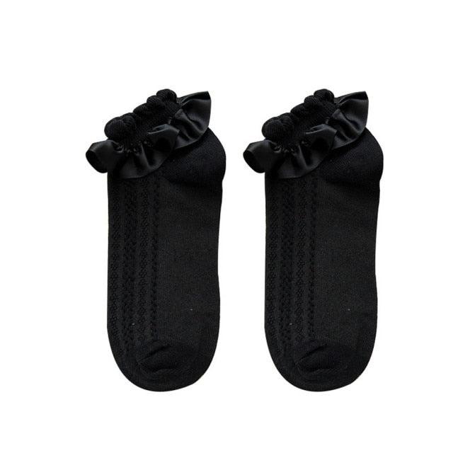 Pair of black ruffle-top short socks with bow accents for cosplay Stevvex crew socks on Tampa Home & Garden Store