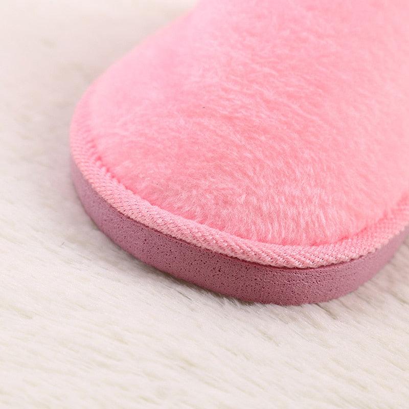 Pink plush indoor slipper with fur lining and soft foam sole on Tampa Home & Garden Store
