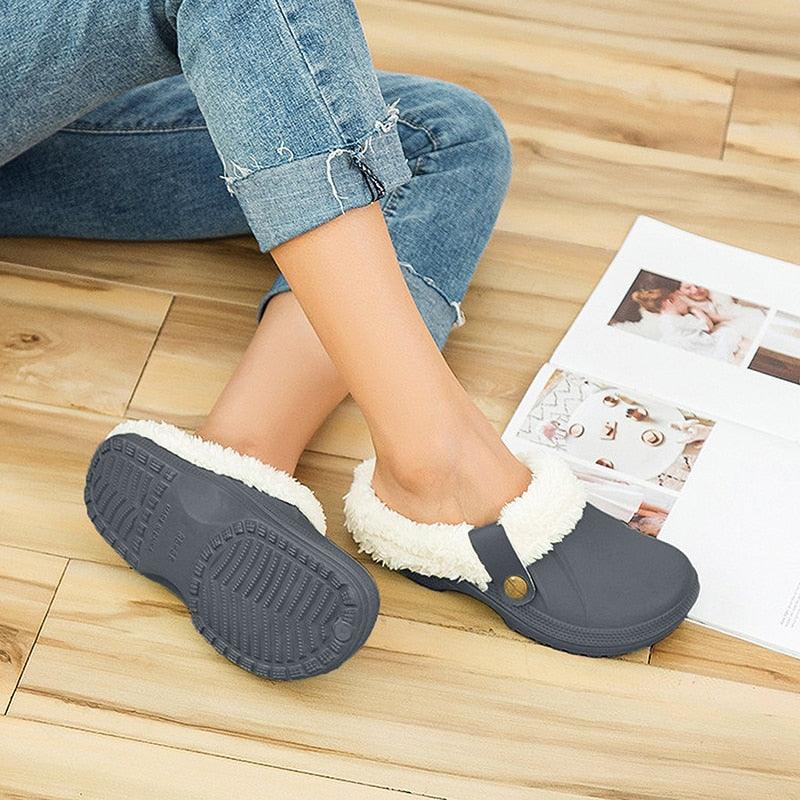 Women’s navy blue fur-lined plush clog slippers with strap and rubber sole for indoor use on Tampa Home & Garden Store