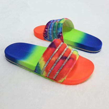 Stevvex rainbow tie-dye slide sandals with rhinestone straps, blue-to-orange gradient sole pair on Tampa Home & Garden Store
