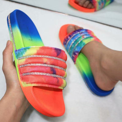 Stevvex rainbow tie-dye slide sandals with rhinestone triple straps and neon orange footbed on Tampa Home & Garden Store