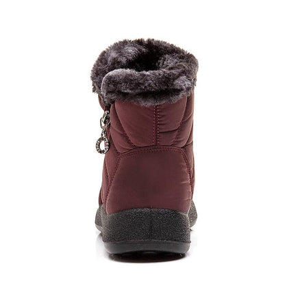 Women’s burgundy fur-lined waterproof winter boot back view with pull tab and black sole on Tampa Home & Garden Store