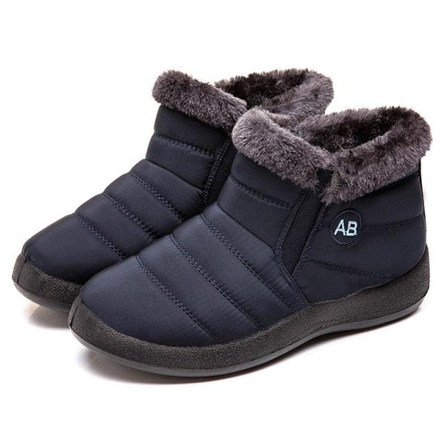 Women navy quilted waterproof snow boots with plush fur lining, slip-on pair on Tampa Home & Garden Store