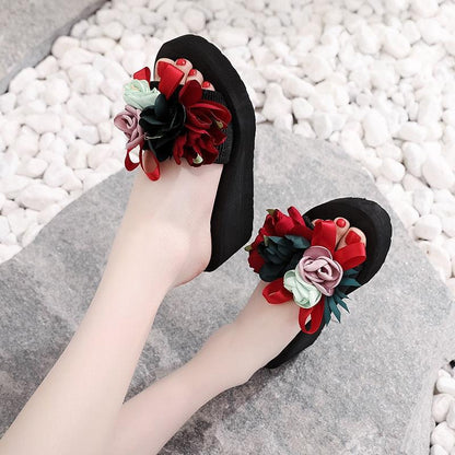 Women bow sandals pair by Stevvex with colorful flower embellishments on black platform sole on Tampa Home & Garden Store