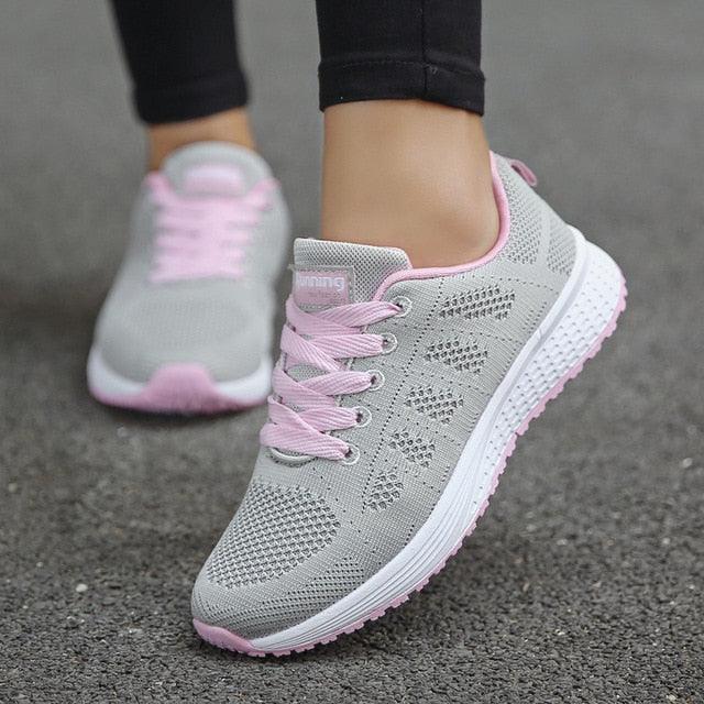 Stevvex women's breathable mesh sneakers pair in light gray with pink laces and white sole on Tampa Home & Garden Store