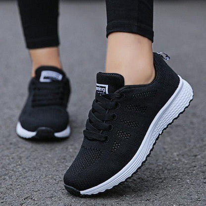 Stevvex women's black mesh sneakers pair with white sole, breathable walking shoes on Tampa Home & Garden Store