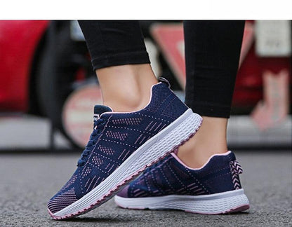 Stevvex women's breathable mesh sneakers pair, navy blue with pink trim and white sole on Tampa Home & Garden Store