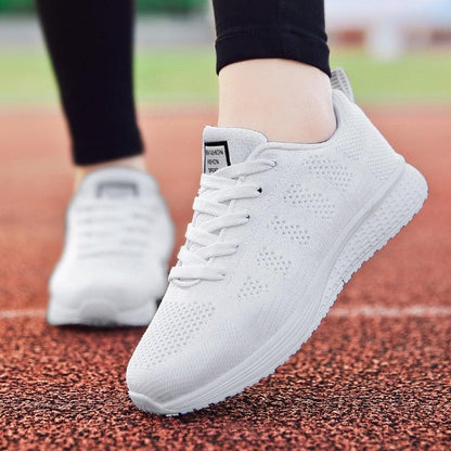 Stevvex white breathable mesh sneakers, lace-up flat running shoes, pair on track on Tampa Home & Garden Store