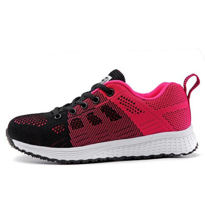 Women’s breathable mesh lace-up flat sneakers in black and pink with white sole by Stevvex on Tampa Home & Garden Store